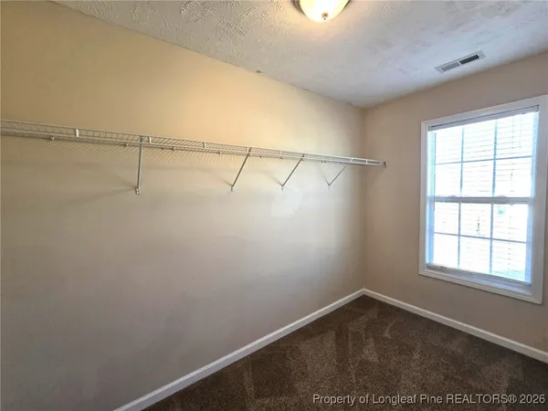 a view of a room with racks on the wall