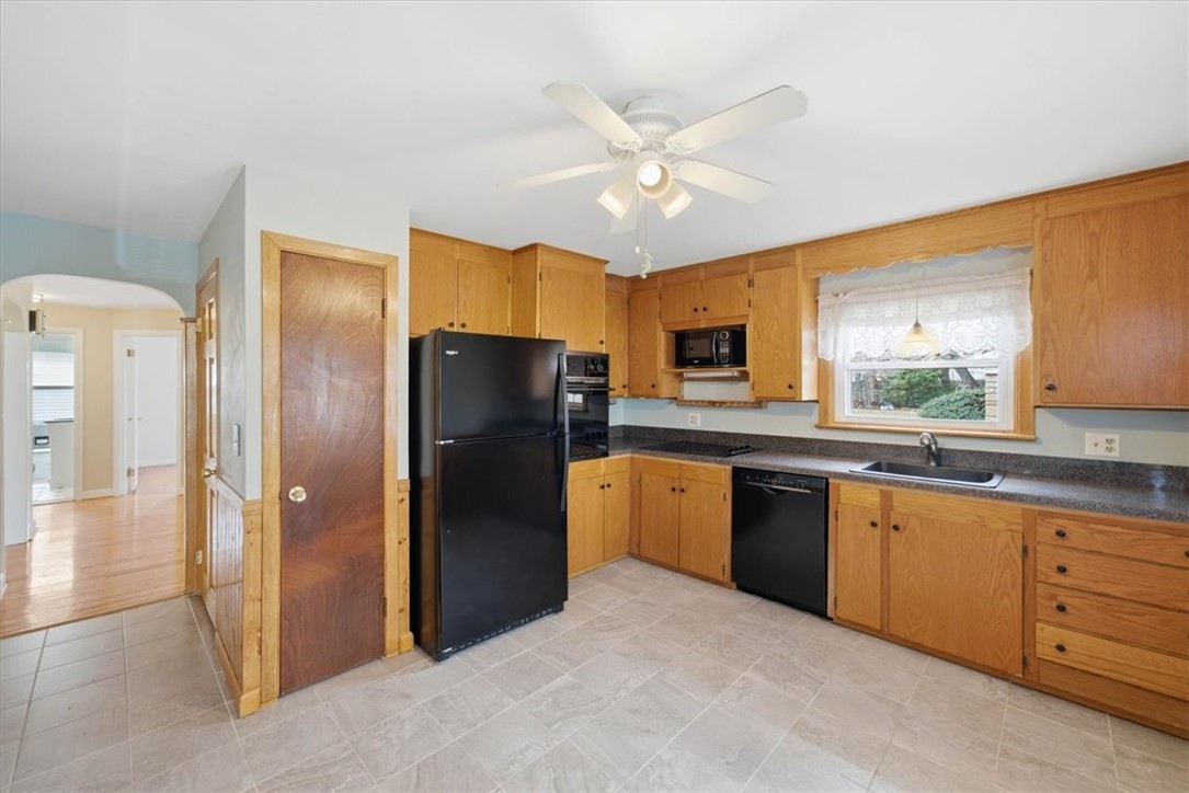 80 Maplecrest Drive Pawtucket, RI 02861 - Photo 14 of 44 Natural light pours in through the window above the sink, while classic pine wainscoting adds character and warmth