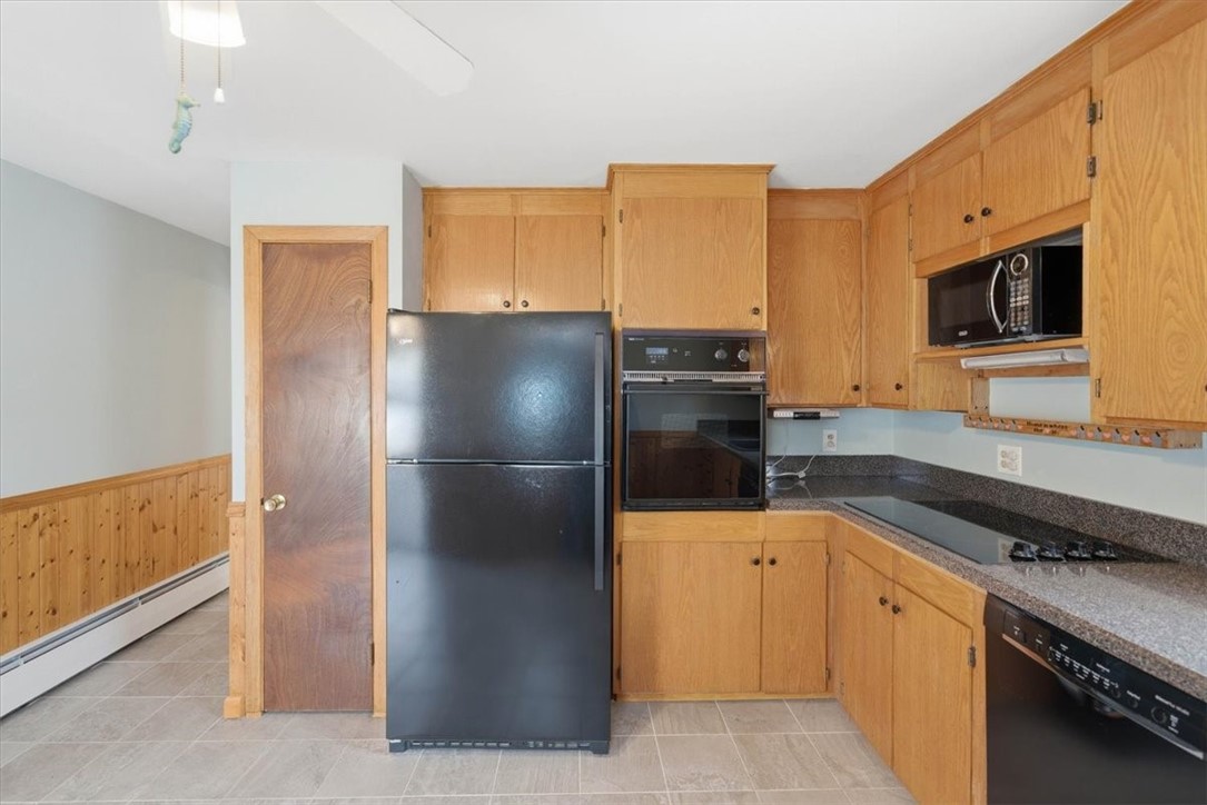 80 Maplecrest Drive Pawtucket, RI 02861 - Photo 17 of 44 Rich knotty pine cabinetry, custom wood detailing, and classic wainscoting throughout
