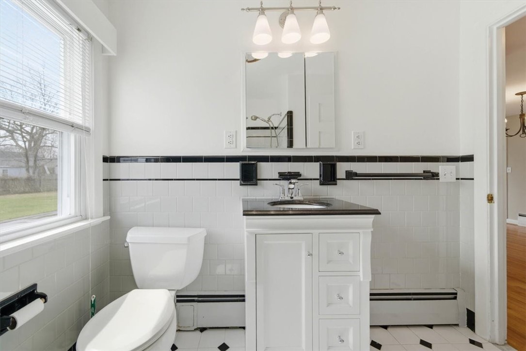 80 Maplecrest Drive Pawtucket, RI 02861 - Photo 23 of 44 The space is filled with natural light from the window and complemented by an updated vanity and lighting. A perfect blend of original character and everyday functionality.