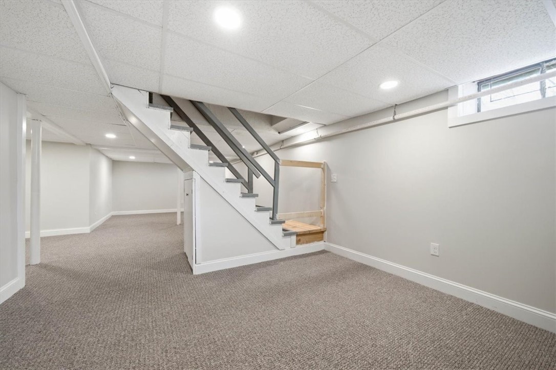 80 Maplecrest Drive Pawtucket, RI 02861 - Photo 30 of 44 Recessed lighting, neutral finishes, and multiple areas that can easily accommodate a family room, home office, gym, or playroom.