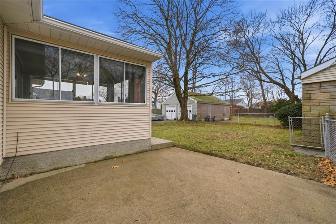 80 Maplecrest Drive Pawtucket, RI 02861 - Photo 34 of 44 Step outside to a spacious patio—ideal for entertaining, grilling, or simply unwinding.
