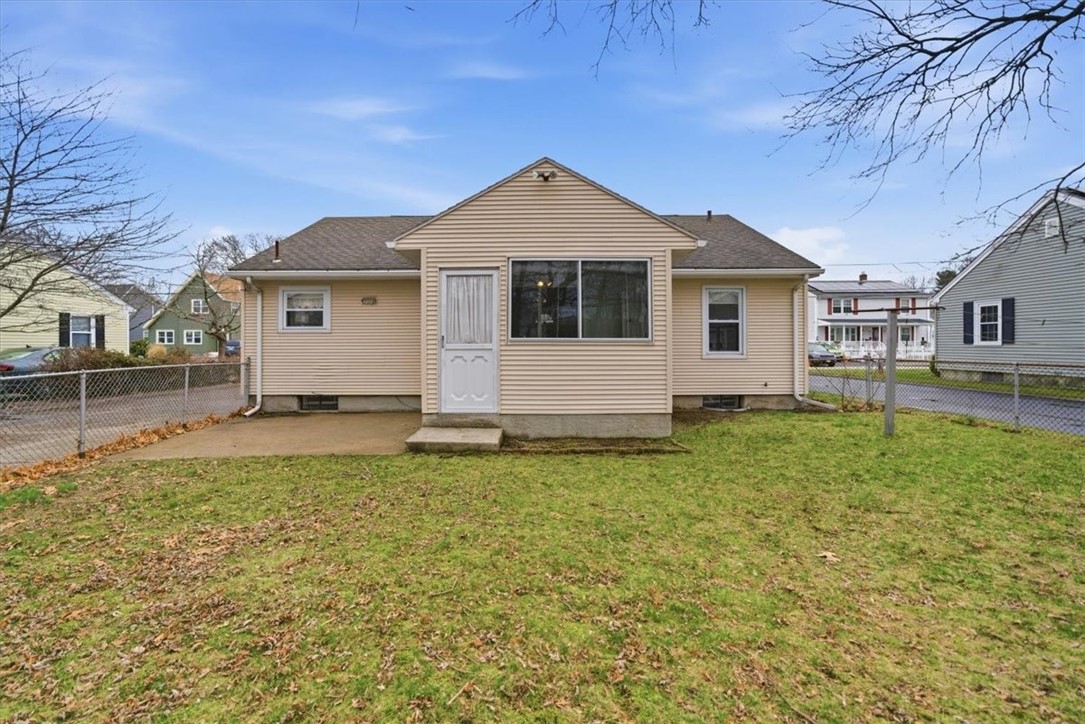 80 Maplecrest Drive Pawtucket, RI 02861 - Photo 35 of 44 The patio overlooks a generously sized, fully fenced backyard offering both privacy and room to play, garden, or gather.