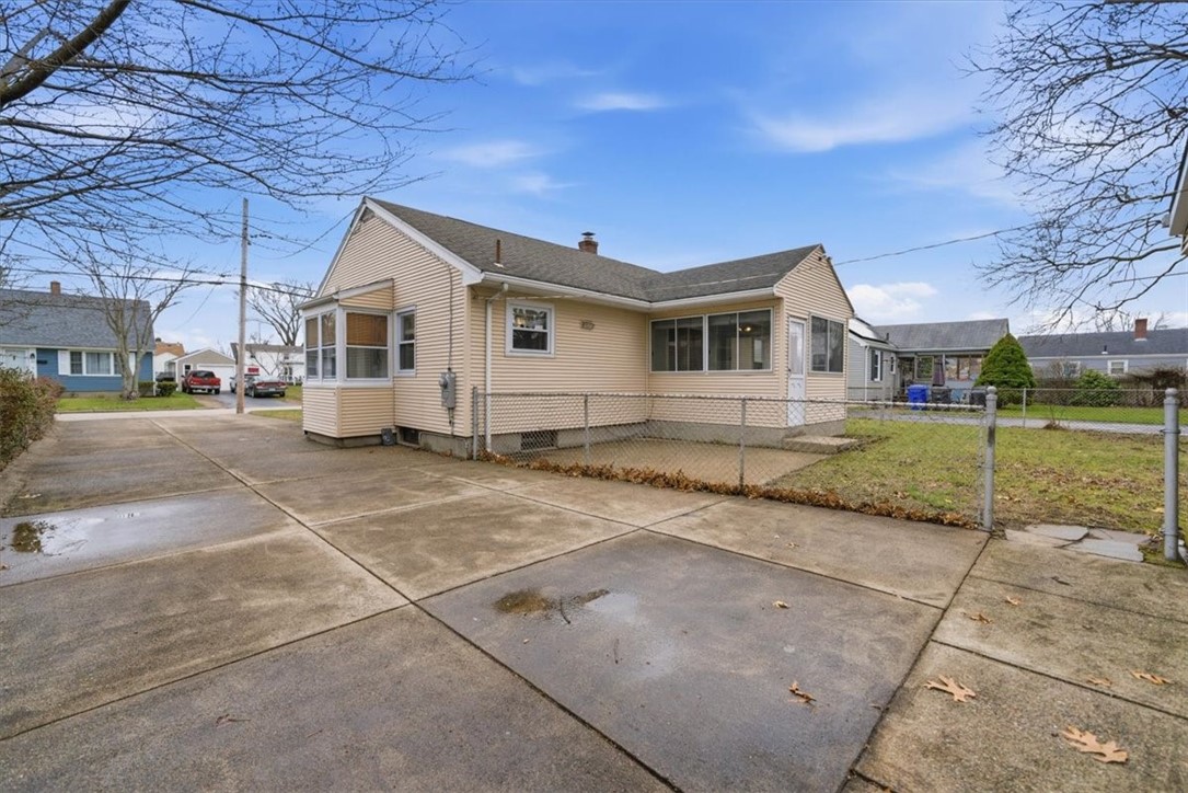 80 Maplecrest Drive Pawtucket, RI 02861 - Photo 36 of 44 A standout feature of this property is the expansive driveway, offering exceptional off-street parking for 6+ vehicles with ease—perfect for multiple cars, guests, or recreational vehicles