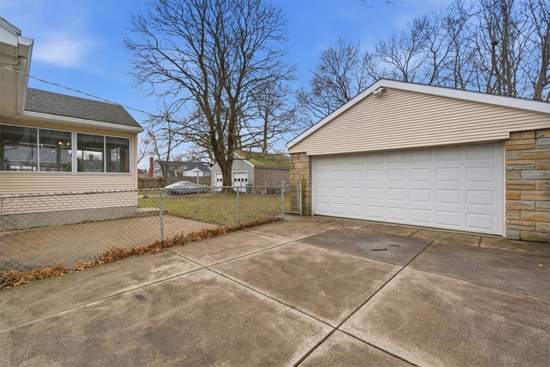 80 Maplecrest Drive Pawtucket, RI 02861 - Photo 37 of 44 Complementing the parking is an oversized 420 sq ft detached 2-car garage, offering ample room not only for vehicles but also for storage, a workshop, or hobby space.