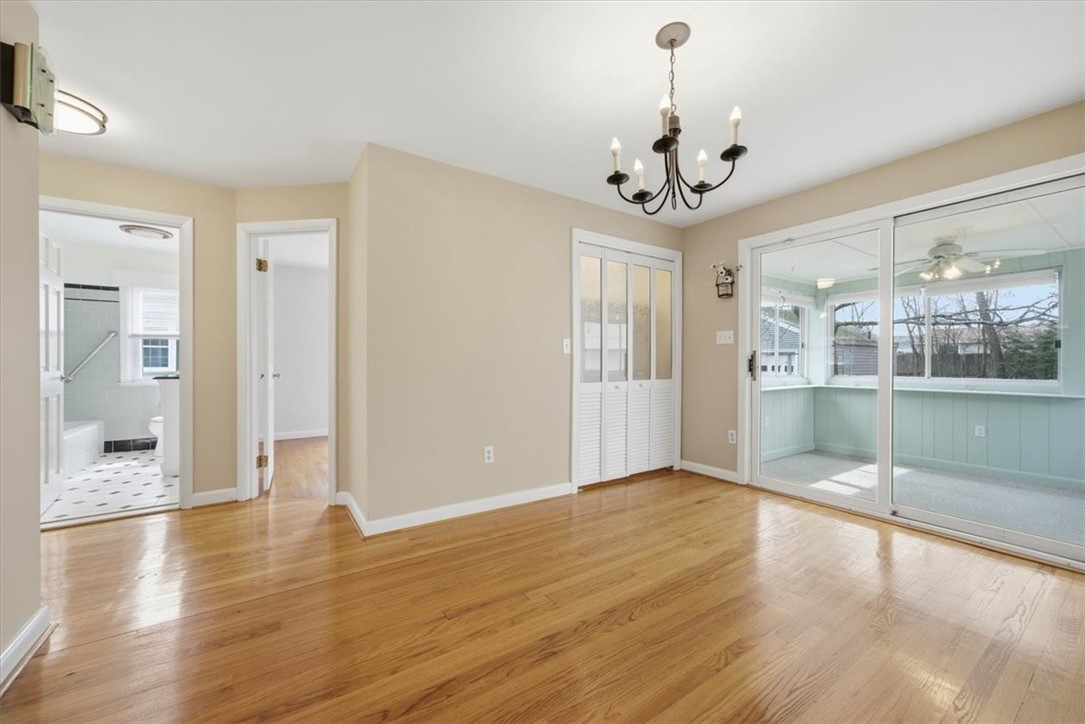 80 Maplecrest Drive Pawtucket, RI 02861 - Photo 10 of 44 Sunlight pours through the oversized windows, and the layout flows effortlessly from living to dining to a bright enclosed sunroom.