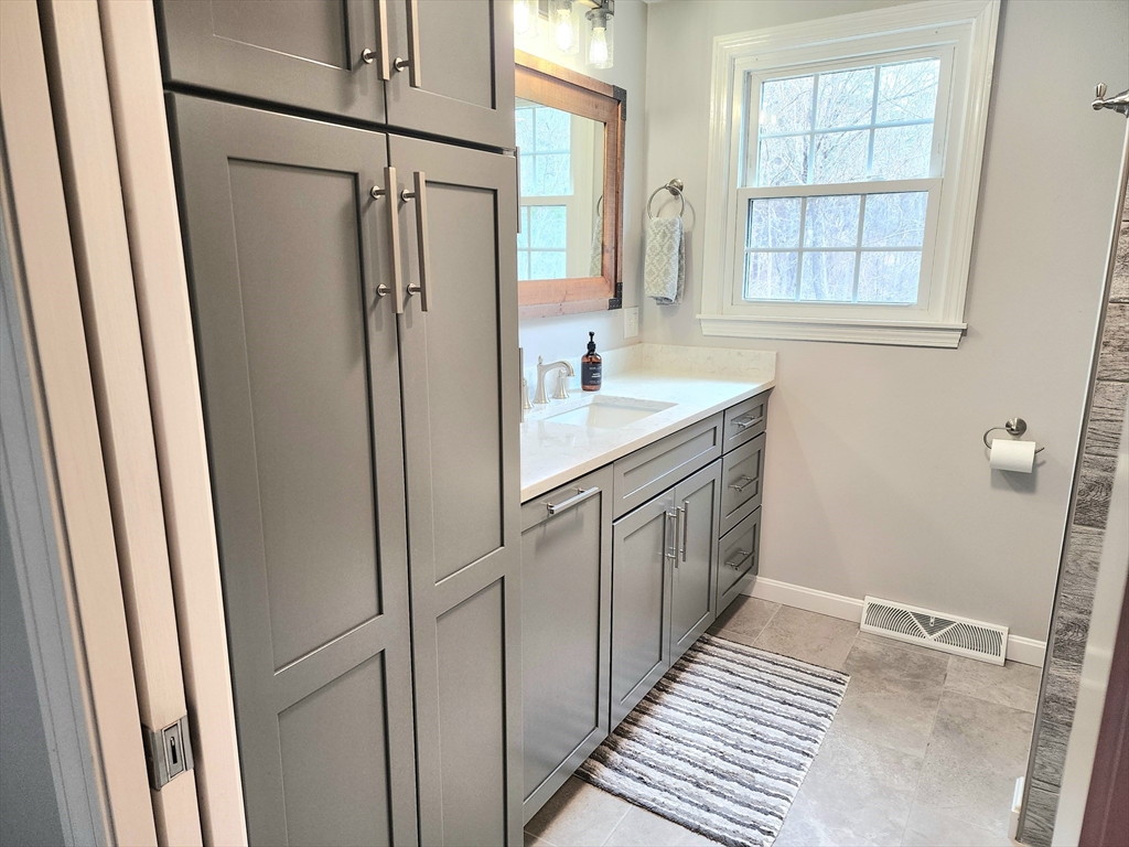 49 Edward Road Townsend, MA 01469 - Photo 14 of 41 a bathroom with a granite countertop sink toilet and shower