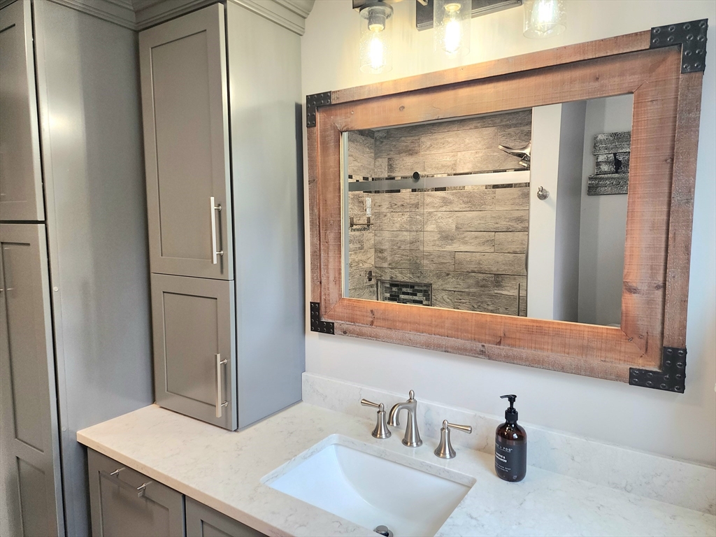 49 Edward Road Townsend, MA 01469 - Photo 17 of 41 a bathroom with a sink and a mirror