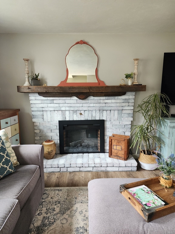 49 Edward Road Townsend, MA 01469 - Photo 21 of 41 a living room with furniture and a fireplace