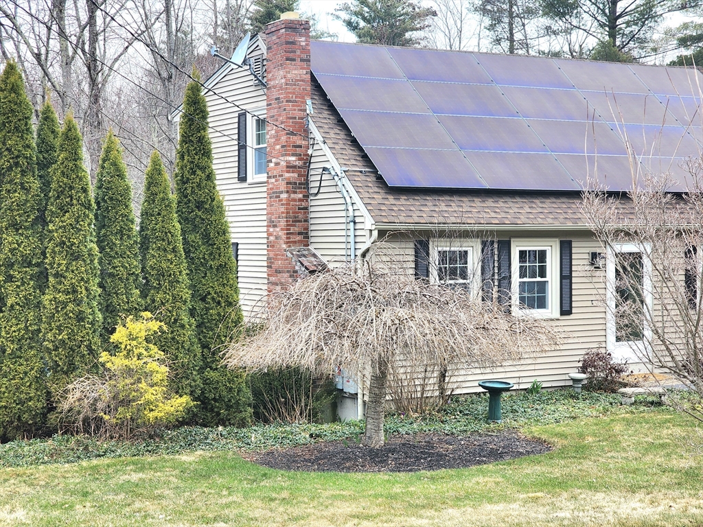 49 Edward Road Townsend, MA 01469 - Photo 3 of 41 a front view of a house with a yard