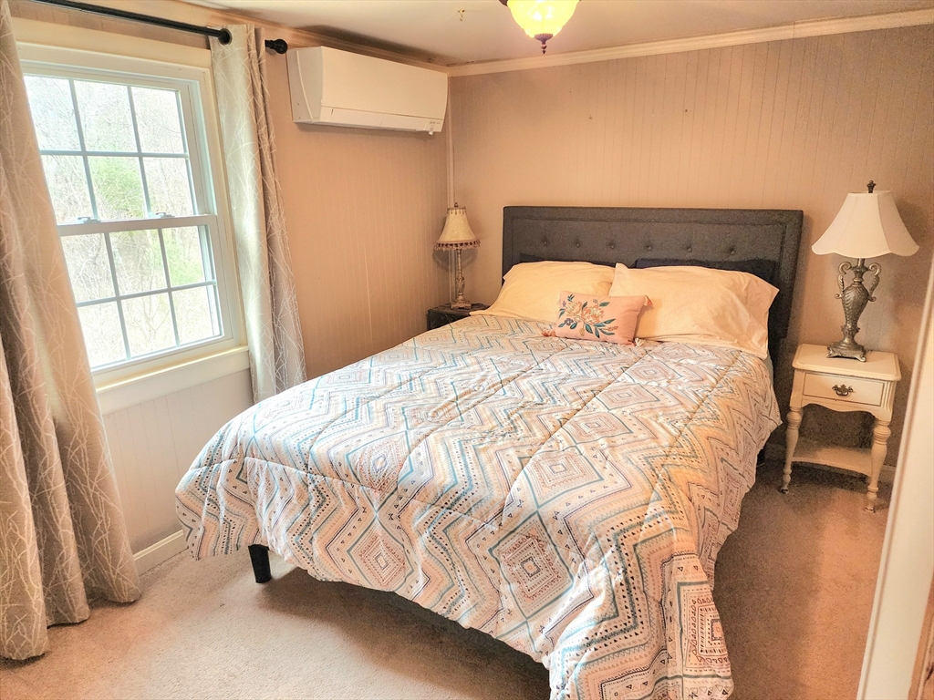49 Edward Road Townsend, MA 01469 - Photo 31 of 41 a bed sitting in a bedroom next to a window
