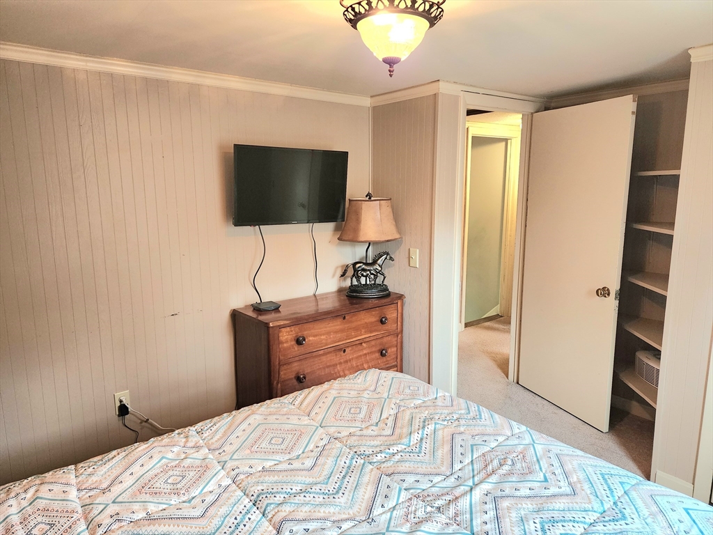49 Edward Road Townsend, MA 01469 - Photo 32 of 41 a bedroom with a bed and a flat screen tv