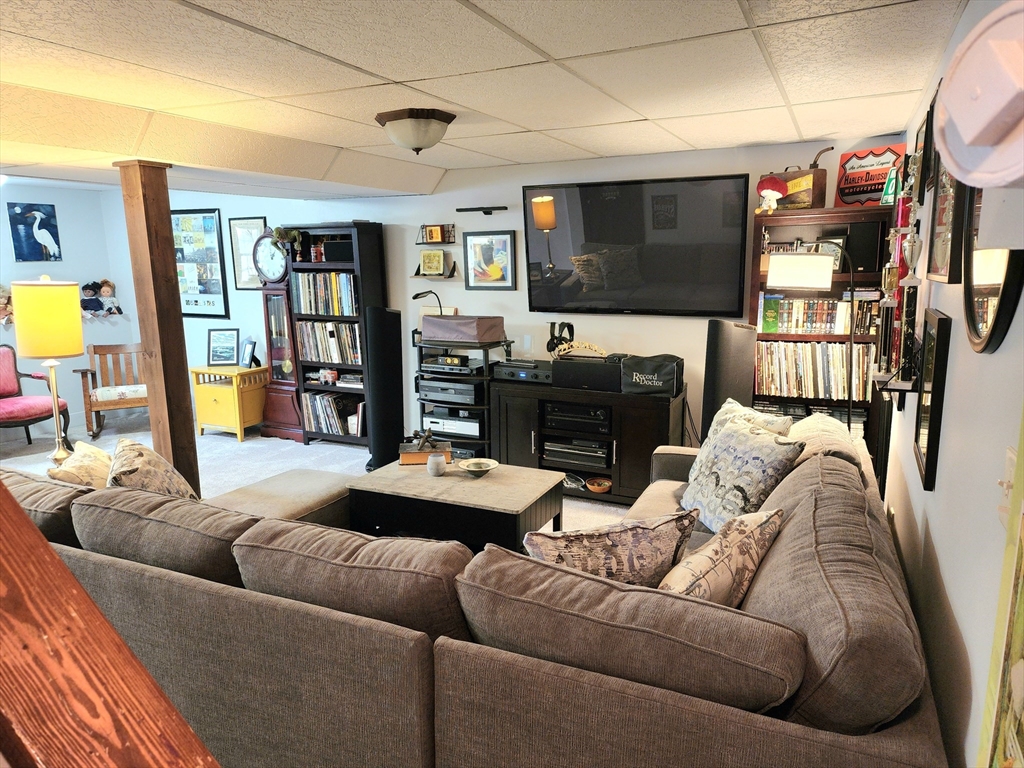 49 Edward Road Townsend, MA 01469 - Photo 37 of 41 a living room with furniture and a flat screen tv