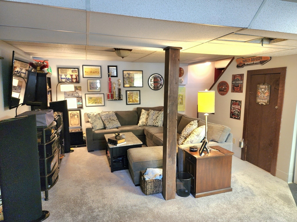 49 Edward Road Townsend, MA 01469 - Photo 38 of 41 a living room with furniture and a flat screen tv