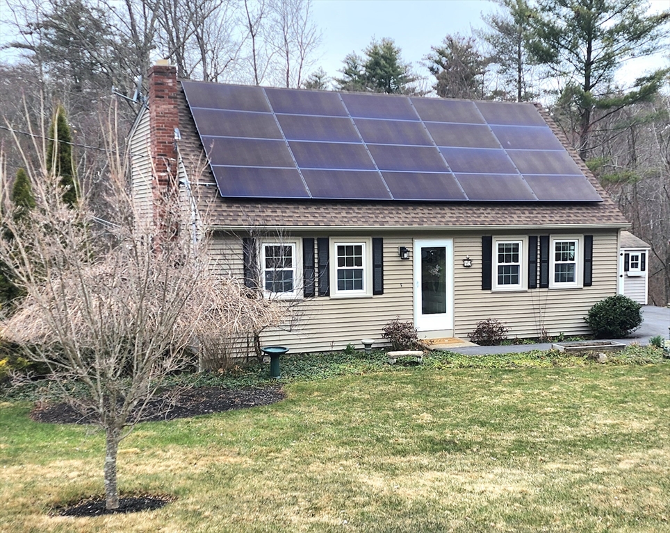 49 Edward Road Townsend, MA 01469 - Photo 4 of 41 a view of a house with a yard and plants