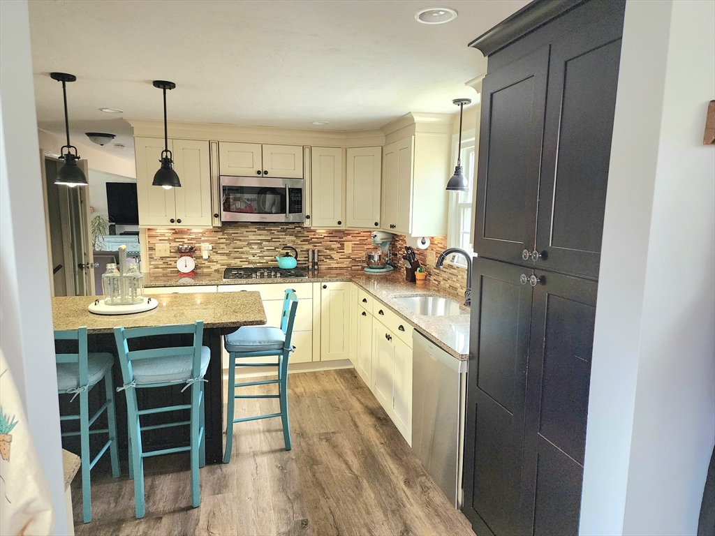 49 Edward Road Townsend, MA 01469 - Photo 6 of 41 a large kitchen with a table and chairs