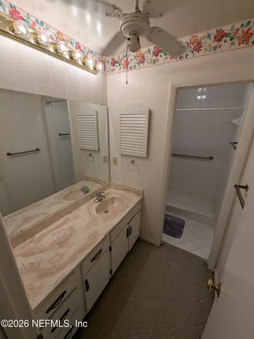 a bathroom with a sink a vanity and mirror