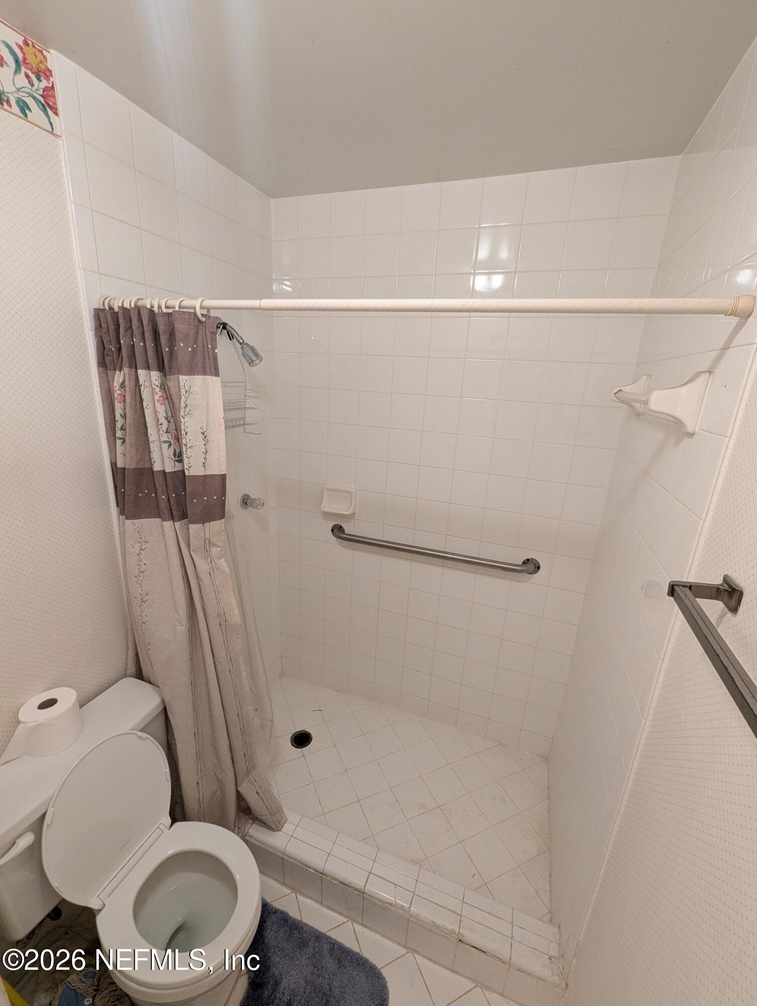 7206 Cypress Cove Road, Unit 14 Jacksonville, FL 32244 - Photo 12 of 23 a bathroom with a toilet and a shower