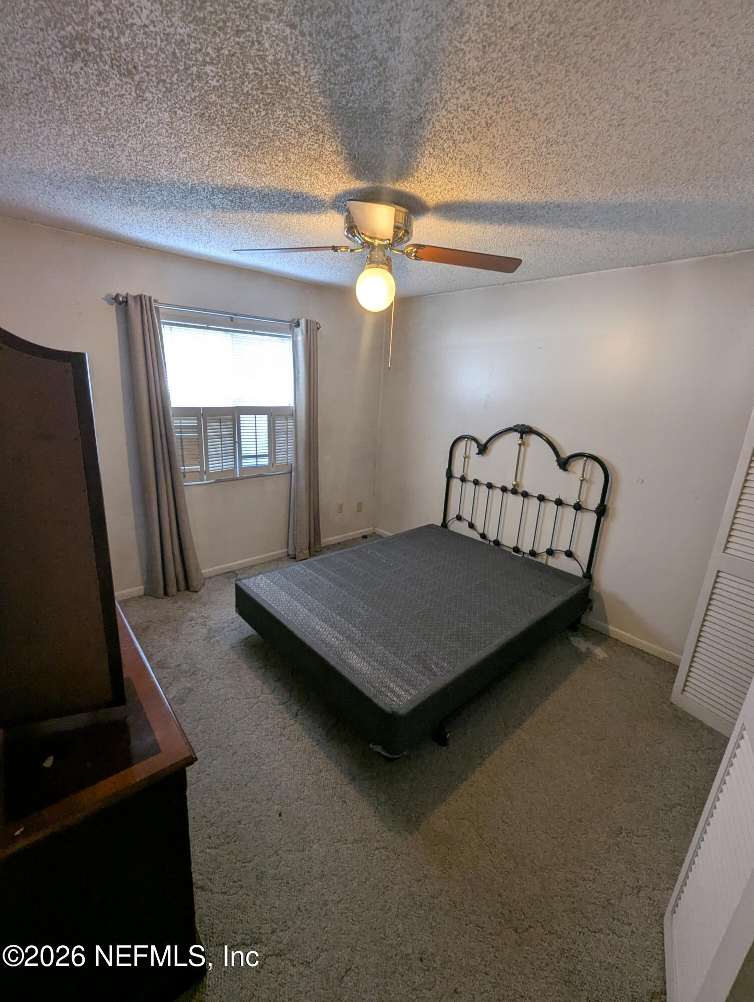 7206 Cypress Cove Road, Unit 14 Jacksonville, FL 32244 - Photo 13 of 23 a bedroom with bunk bed and a window