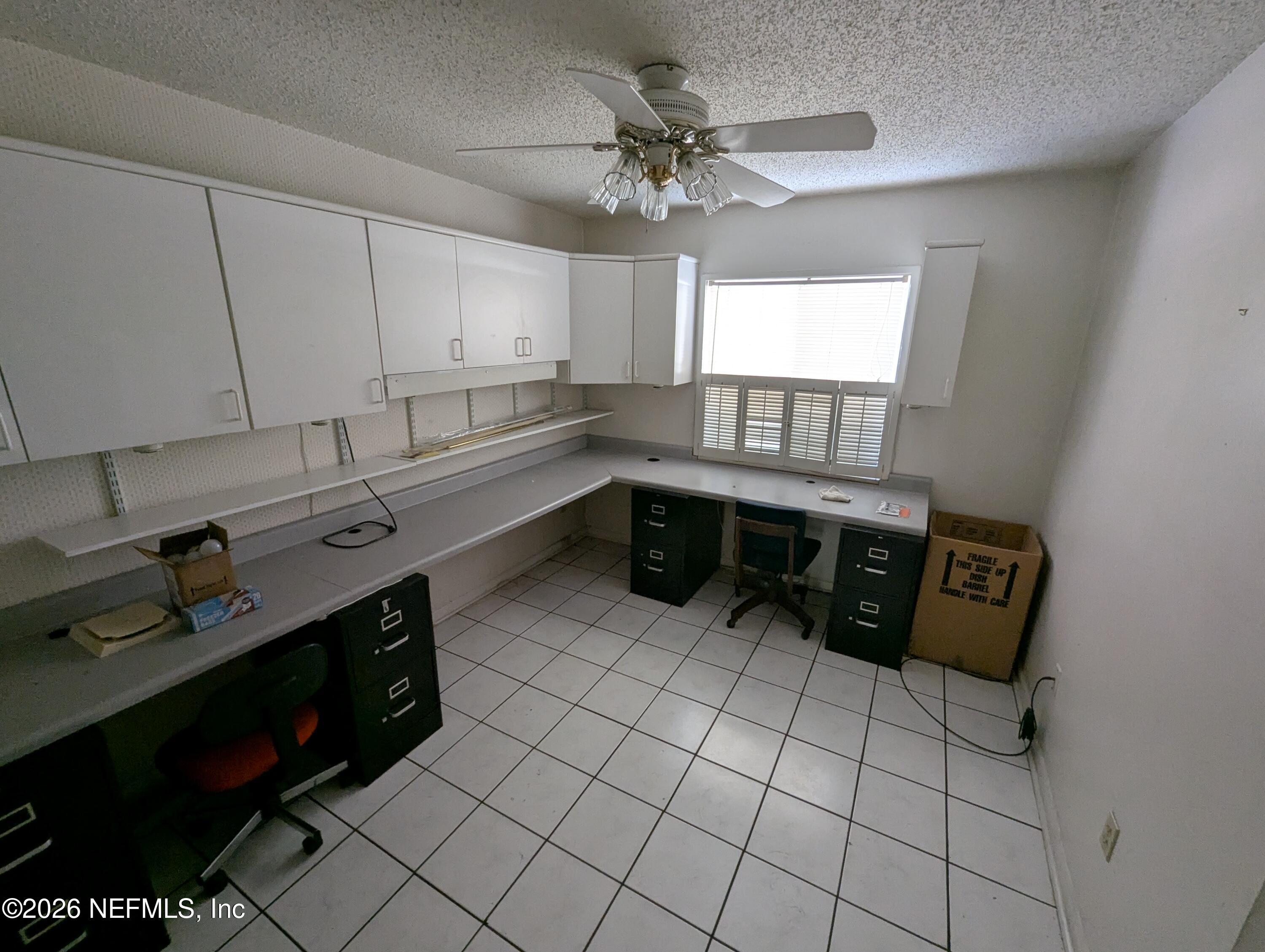 7206 Cypress Cove Road, Unit 14 Jacksonville, FL 32244 - Photo 15 of 23 a kitchen with stainless steel appliances a sink a stove a refrigerator and cabinets