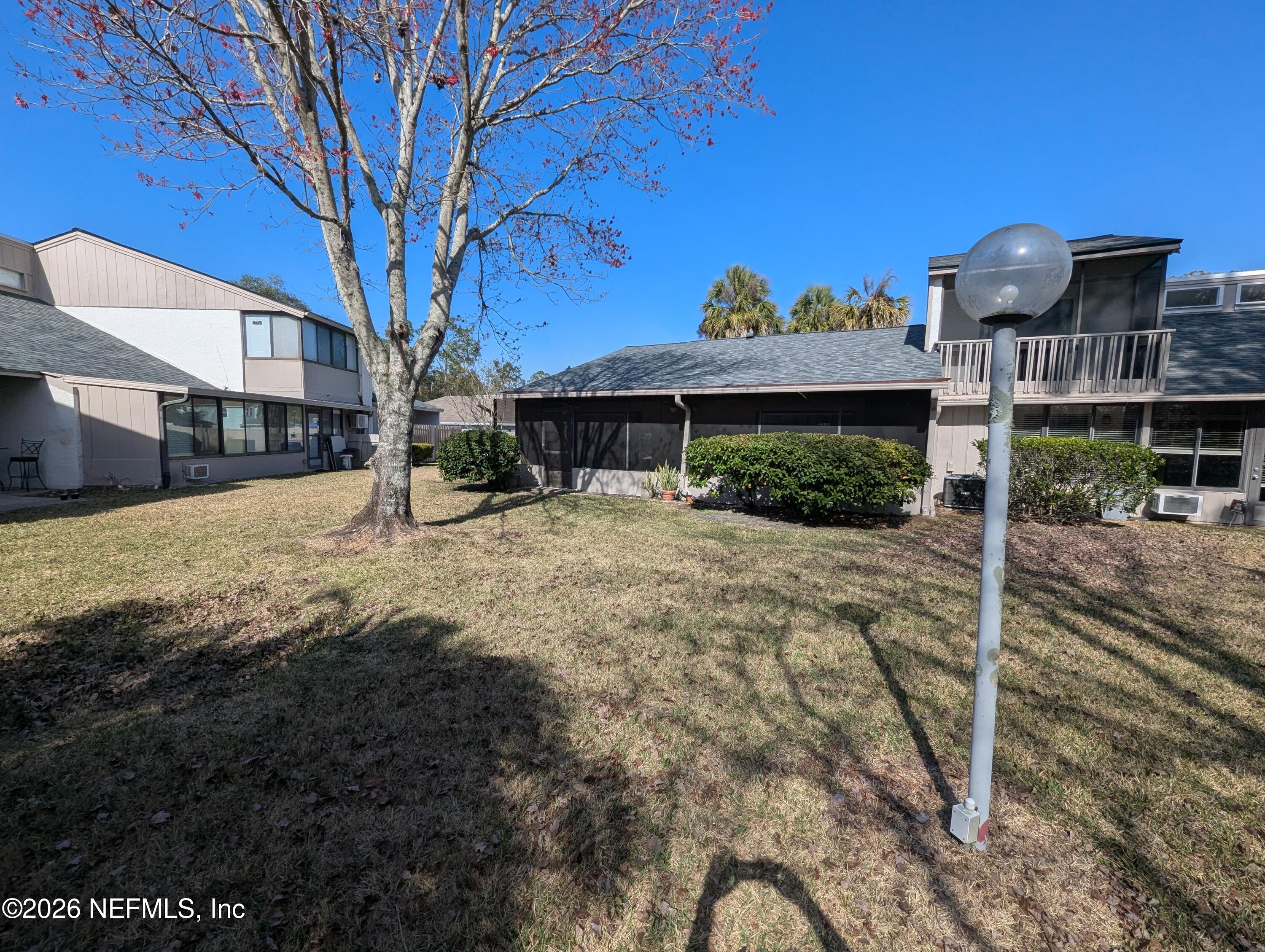 7206 Cypress Cove Road, Unit 14 Jacksonville, FL 32244 - Photo 22 of 23 a view of a house with a yard