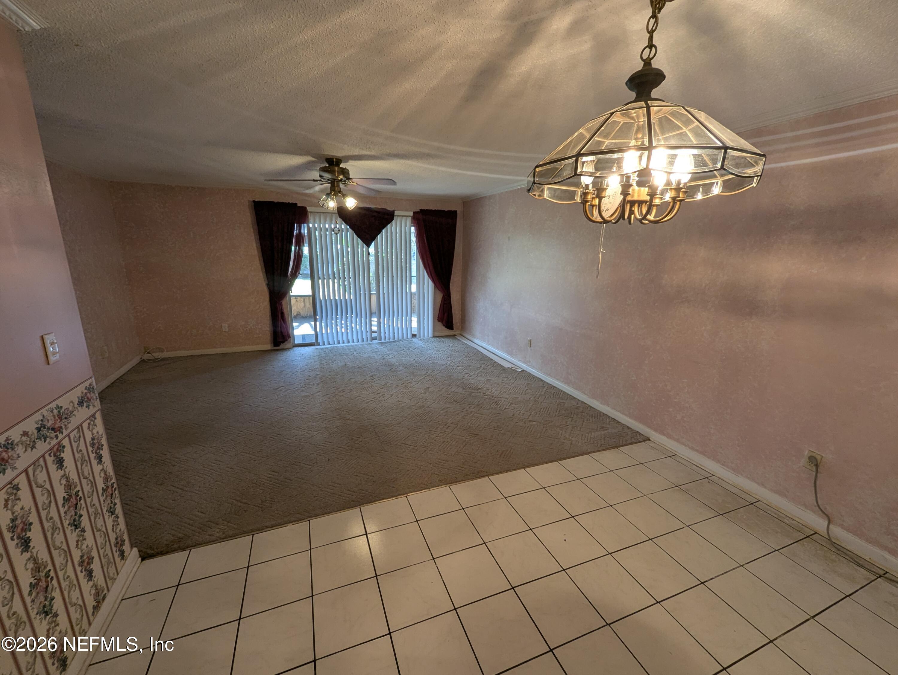 7206 Cypress Cove Road, Unit 14 Jacksonville, FL 32244 - Photo 6 of 23 a view of empty room with wooden floor