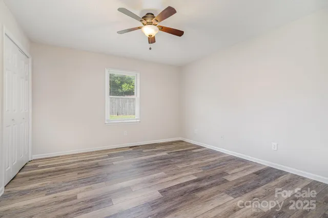 a view of workspace with wooden floor and window
