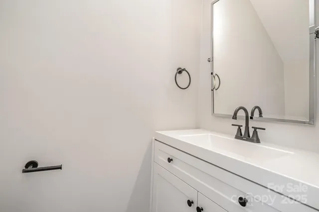 a bathroom with a sink and mirror
