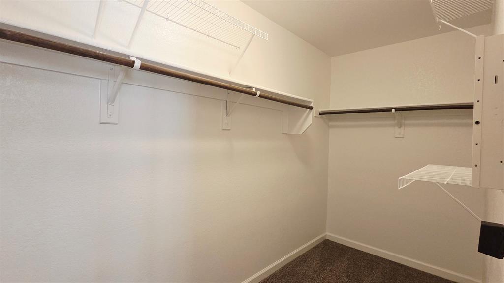 824 Rivers Creek Lane Little Elm, TX 75068 - Photo 11 of 20 a view of a room with racks on the wall