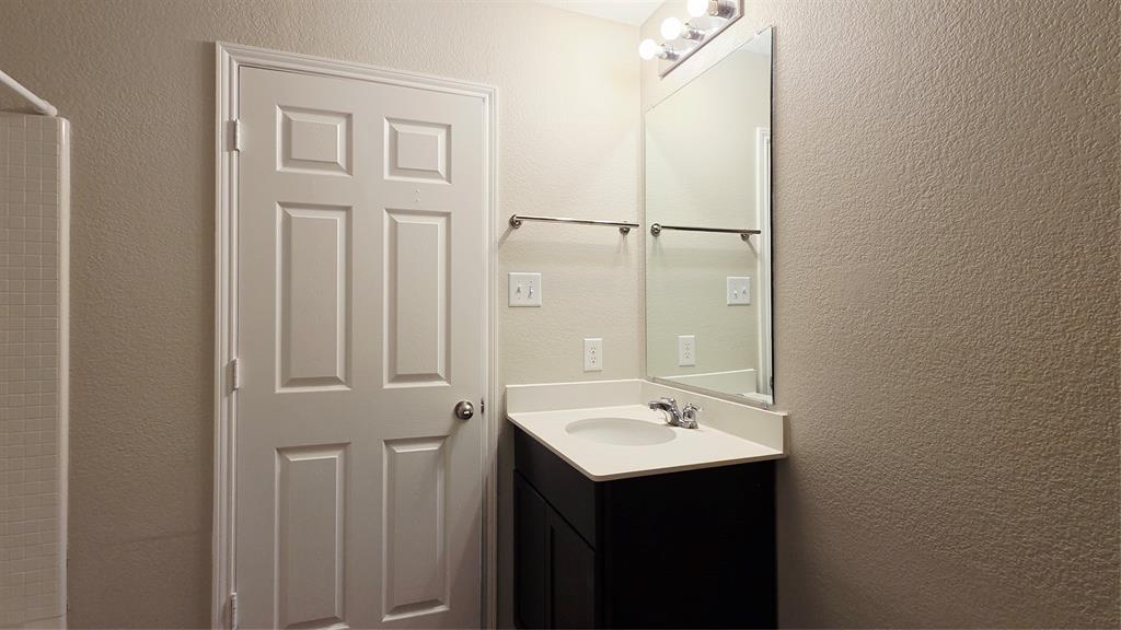 824 Rivers Creek Lane Little Elm, TX 75068 - Photo 12 of 20 a bathroom with a sink and mirror