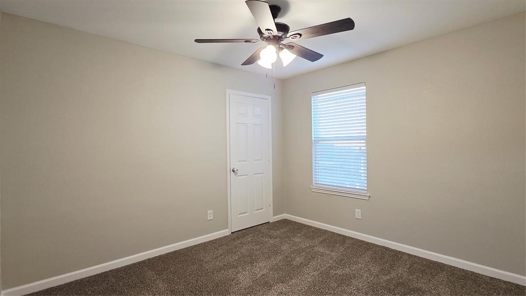 824 Rivers Creek Lane Little Elm, TX 75068 - Photo 16 of 20 an empty room with windows and fan