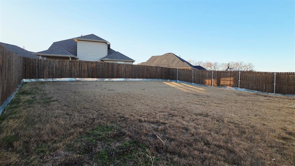824 Rivers Creek Lane Little Elm, TX 75068 - Photo 19 of 20 a backyard of a house