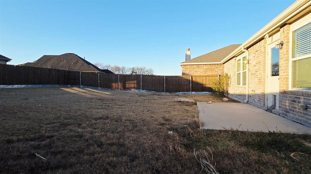 824 Rivers Creek Lane Little Elm, TX 75068 - Photo 20 of 20 a view of backyard of house and car parked