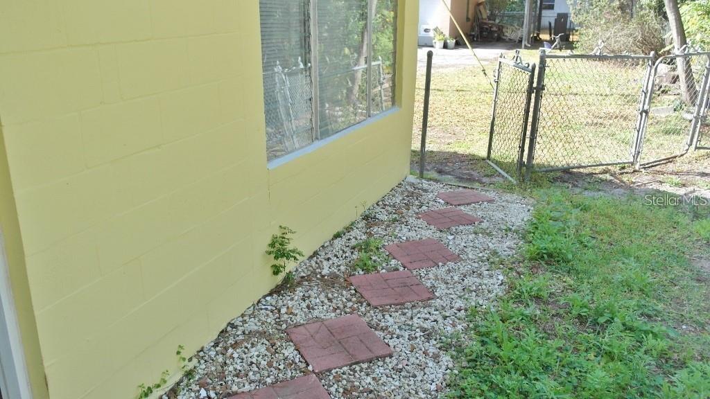 141 Sunnytown Road Casselberry, FL 32707 - Photo 16 of 18 a view of a pathway of a house with backyard