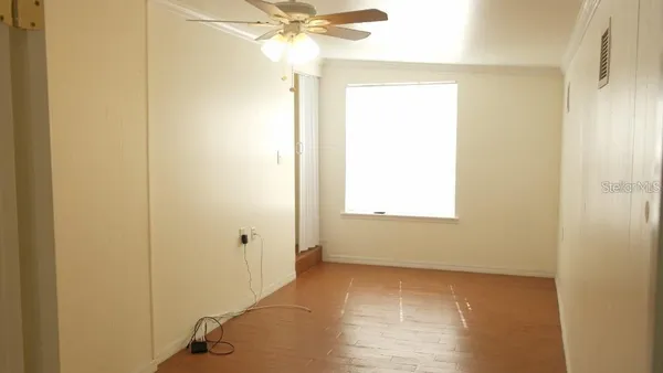 a view of an empty room with a window