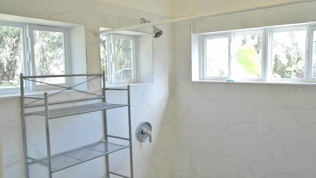 141 Sunnytown Road Casselberry, FL 32707 - Photo 7 of 18 a room with a window and chandelier