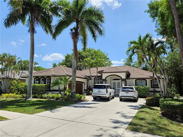 a front view of a house with garden and porch