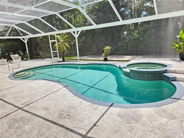 a view of a swimming pool with a patio