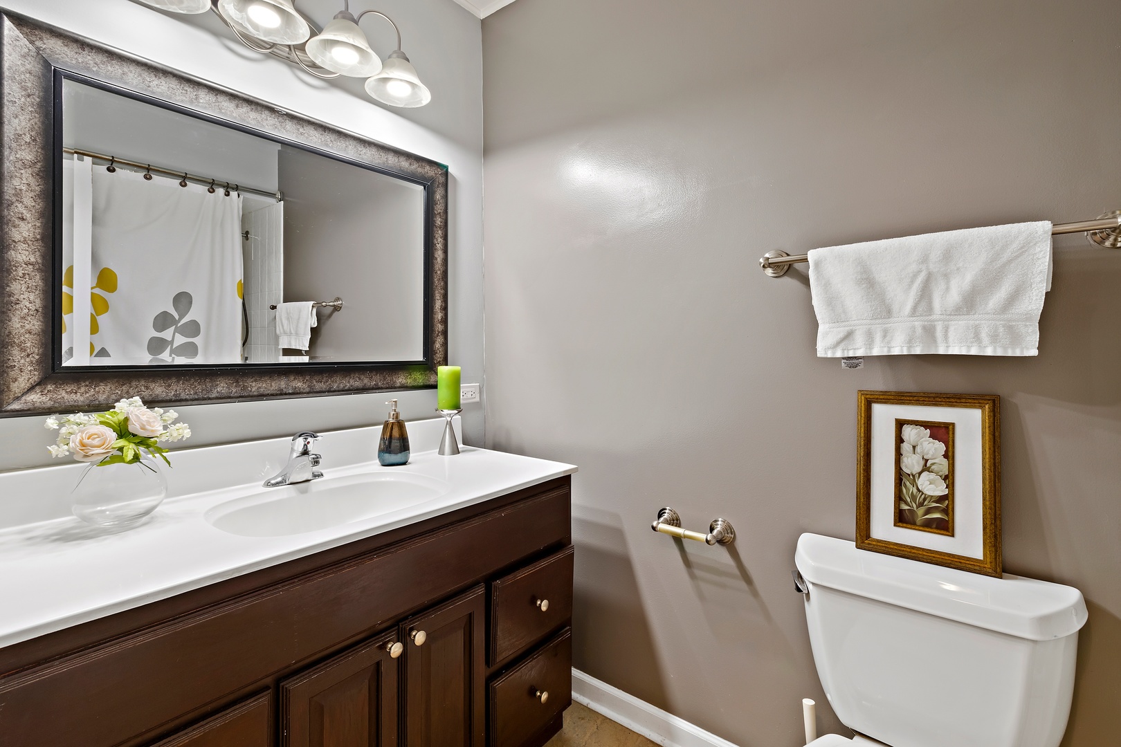 245 Washington Boulevard Hoffman Estates, IL 60169 - Photo 13 of 19 a bathroom with a toilet sink and mirror