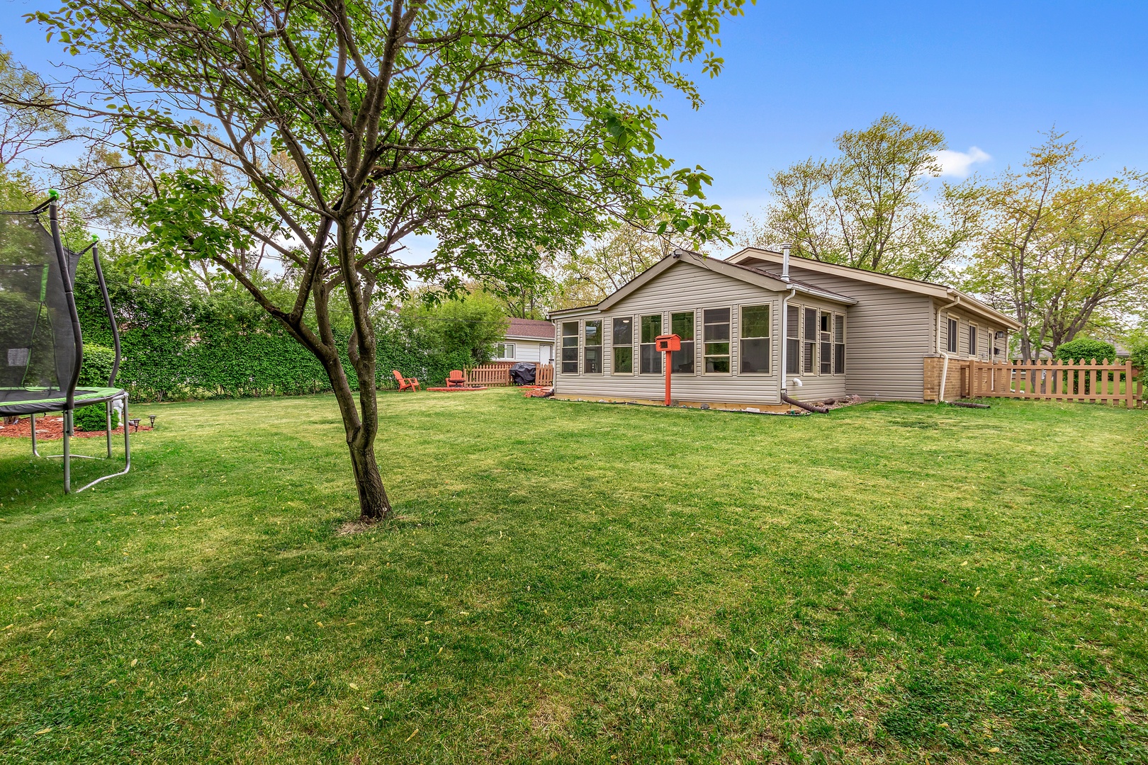 245 Washington Boulevard Hoffman Estates, IL 60169 - Photo 19 of 19 a front view of a house with a yard