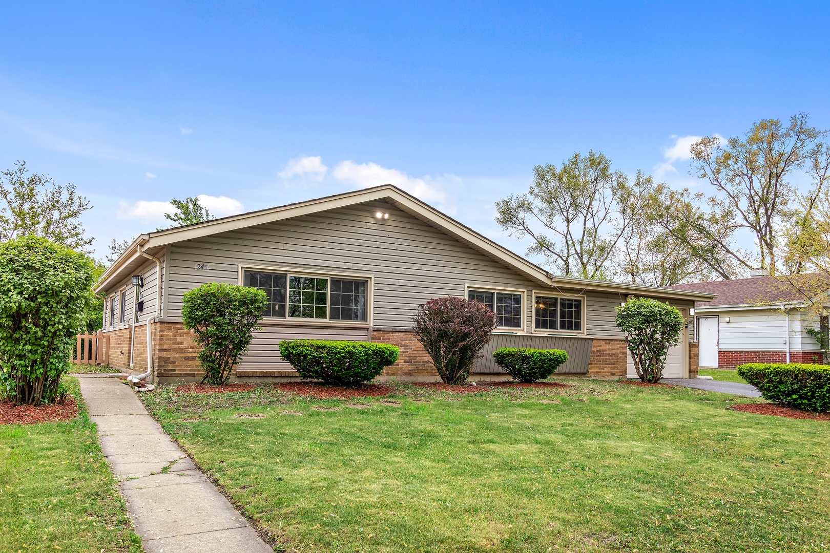 245 Washington Boulevard Hoffman Estates, IL 60169 - Photo 3 of 19 a view of a house with backyard and garden