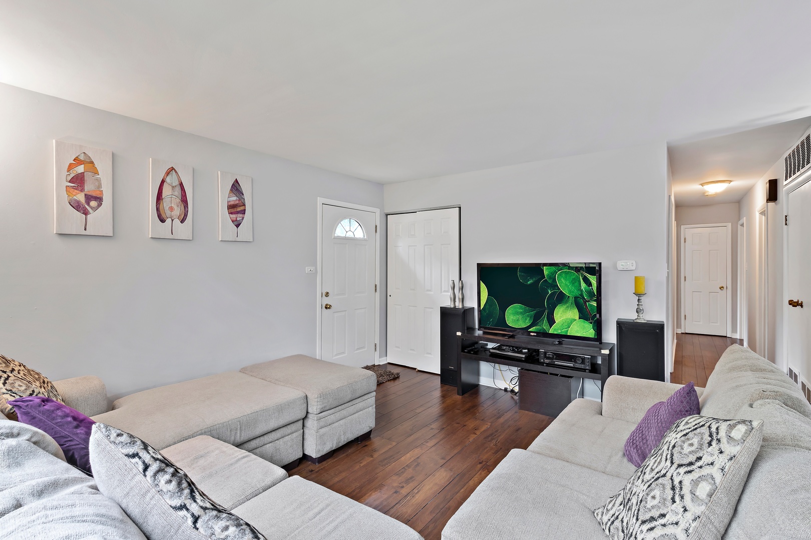 245 Washington Boulevard Hoffman Estates, IL 60169 - Photo 4 of 19 a living room with furniture and a flat screen tv