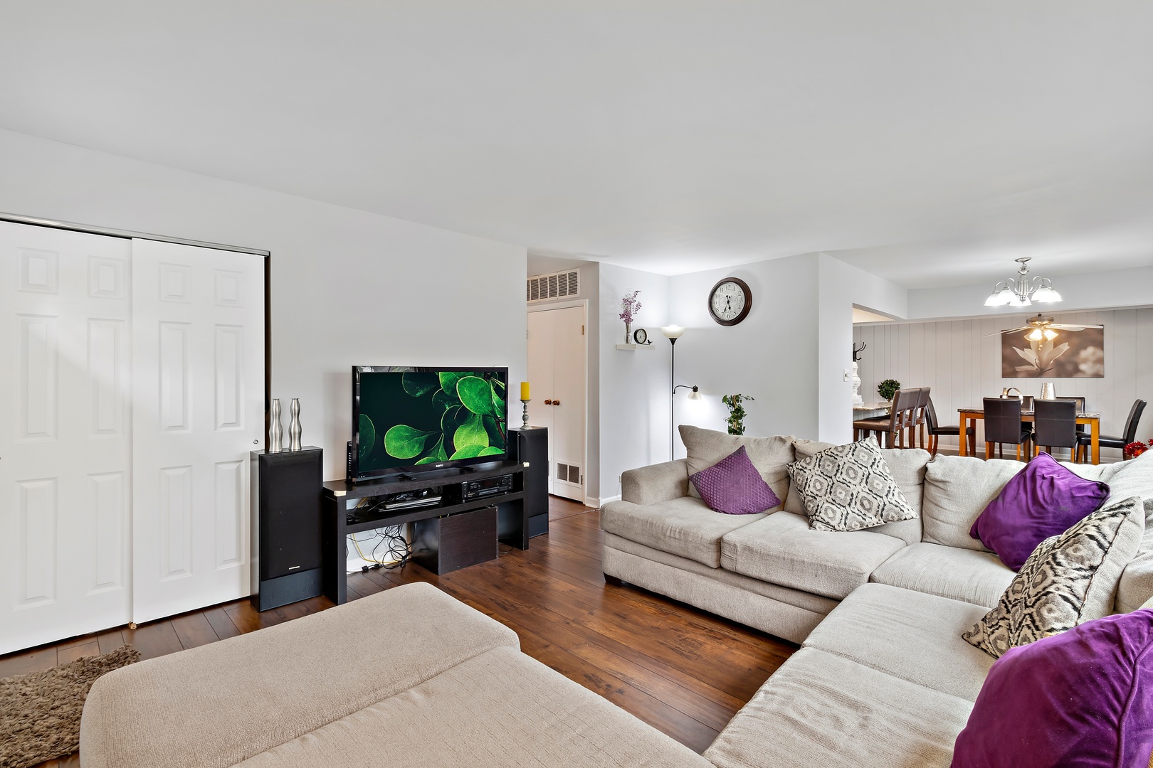 245 Washington Boulevard Hoffman Estates, IL 60169 - Photo 6 of 19 a living room with furniture and a flat screen tv