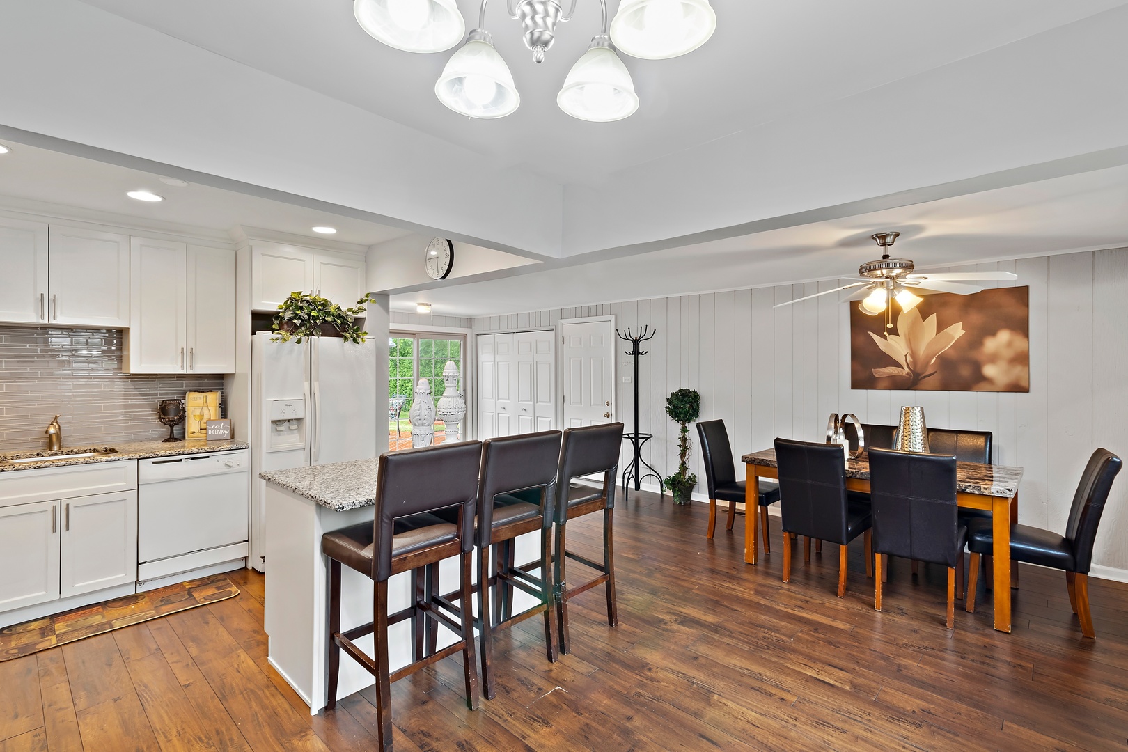 245 Washington Boulevard Hoffman Estates, IL 60169 - Photo 7 of 19 a view of a dining room with furniture and wooden floor