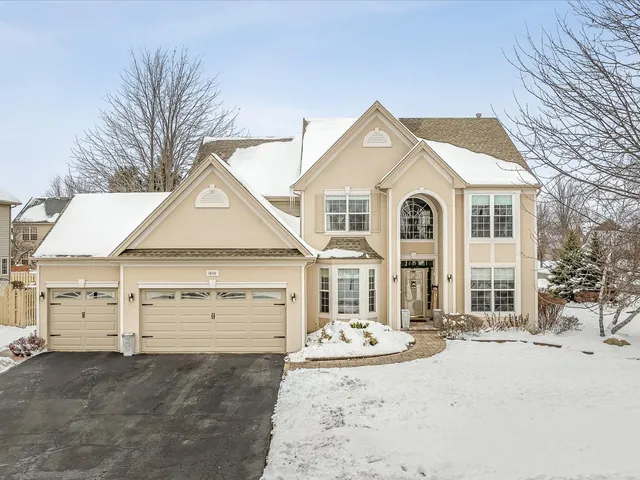 a view of a house with a snow in the yard