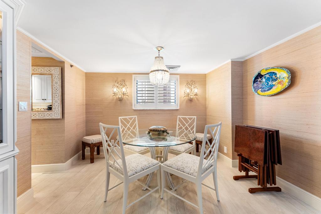 200 Ocean Trail Way, Unit T7 Jupiter, FL 33477 - Photo 11 of 46 a dining room with furniture and window