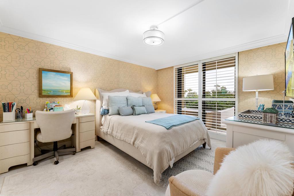 200 Ocean Trail Way, Unit T7 Jupiter, FL 33477 - Photo 18 of 46 a spacious bedroom with a bed and a large window