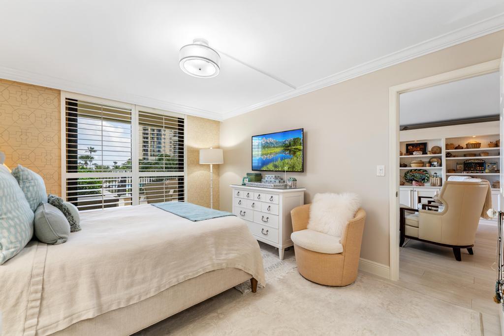 200 Ocean Trail Way, Unit T7 Jupiter, FL 33477 - Photo 20 of 46 a bedroom with furniture and a large window