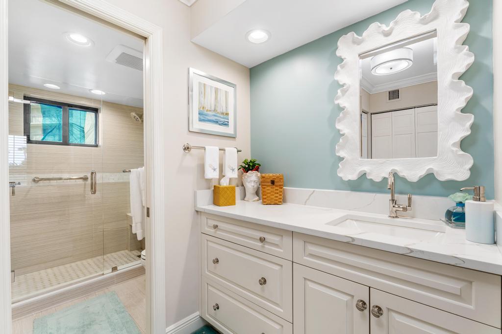 200 Ocean Trail Way, Unit T7 Jupiter, FL 33477 - Photo 24 of 46 a bathroom with a sink a toilet and shower