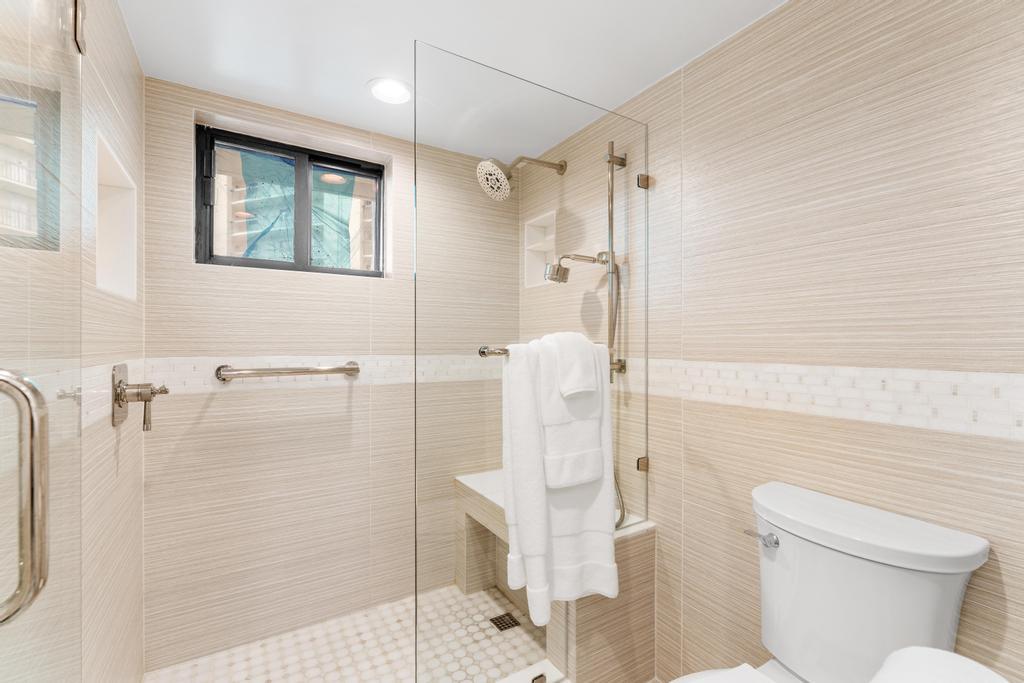 200 Ocean Trail Way, Unit T7 Jupiter, FL 33477 - Photo 25 of 46 a bathroom with a shower and toilet